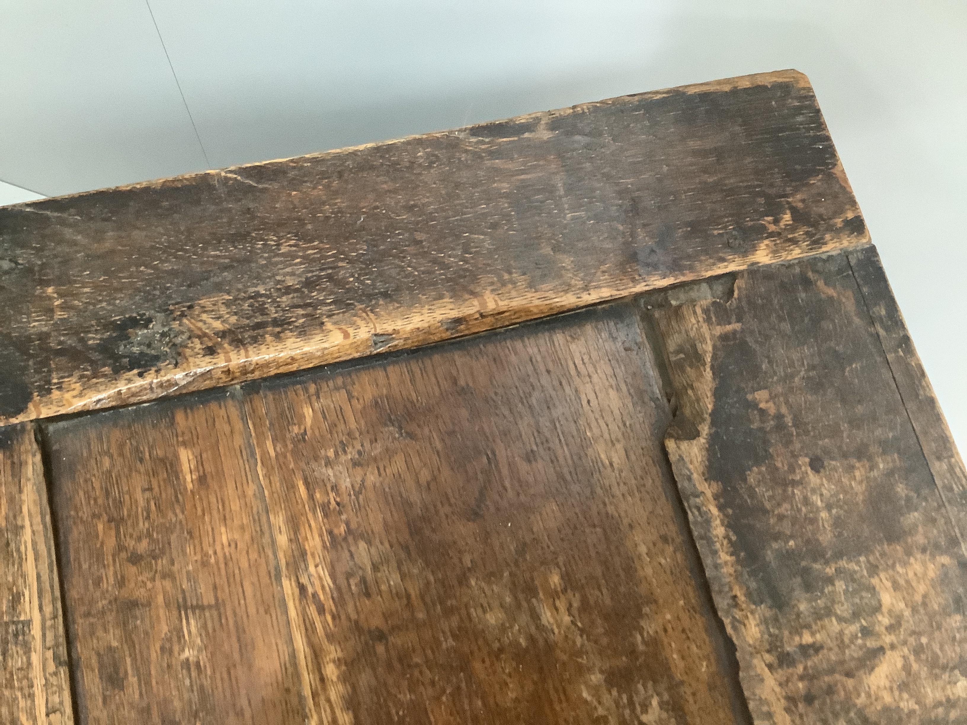 A small 17th century and later panelled oak coffer, width 99cm, depth 48cm, height 54cm